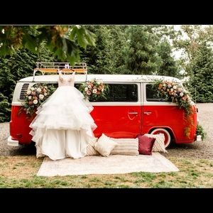 . Full flowing  hugs in at waist long train